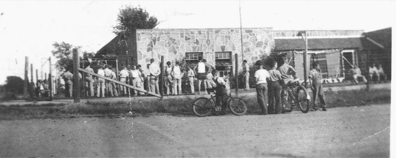 black and white photo of prisoners at the prisoner of war camp