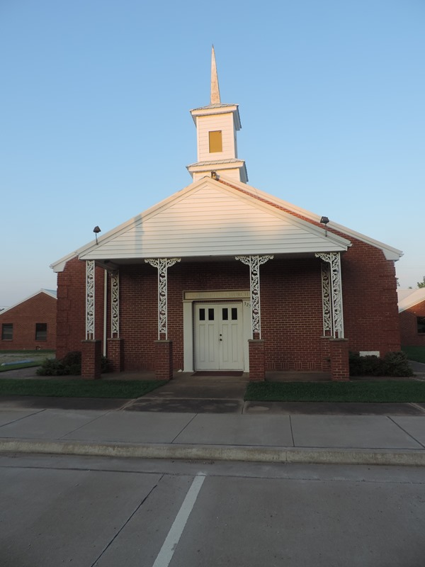 red brick church building with steeple